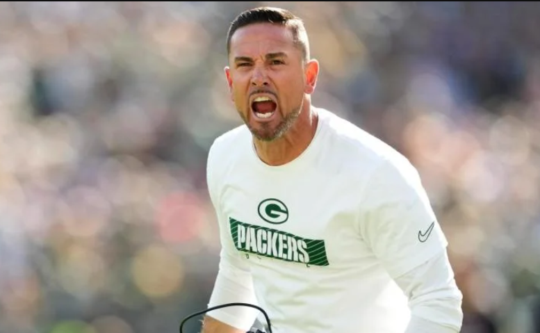 Matt LaFleur, head coach of the Green Bay Packers, is a well-known figure in the NFL. But who stands beside him in his personal life?
In this blog post, we delve into the life of Matt LaFleur's wife. While Matt's football achievements are often in the spotlight, his wife plays a significant role behind the scenes. She provides support, love, and stability in their family life.
This introduction will glimpse her background, relationship, and impact on Matt's career. Join us as we explore the life of the woman who shares her journey with one of the NFL's top coaches.
Wiki/Bio Table for Matt LaFleur
Attribute	Details
Full Name	Matthew Patrick LaFleur
Date of Birth	November 3, 1979
Place of Birth	Mount Pleasant, Michigan, USA
Age	45 years (as of 2024)
Gender	Male
Sexual Orientation	Straight
Nationality	American
Ethnicity	Caucasian
Height	5 feet 11 inches (180 cm)
Weight	Approximately 185 lbs (84 kg)
Eye Color	Dark Brown
Hair Color	Black
Body Type	Athletic
Relationship Status	Married
Spouse	BreAnne Maak LaFleur
Children	Two sons, Luke and Ty
Parents	Denny LaFleur (father), Kristi LaFleur (mother)
Siblings	Mike LaFleur (brother)
Education	Saginaw Valley State University
Occupation	NFL Head Coach
Years Active	2003–present
Notable Roles	Head Coach of Green Bay Packers
Net Worth	Estimated at $10 million (as of 2024)
________________________________________
Who Is Matt LaFleur?
Matthew Patrick LaFleur, born November 3, 1979, in Mount Pleasant, Michigan, is a prominent NFL head coach. He currently leads the Green Bay Packers. Known for his strategic acumen and leadership skills, LaFleur has become one of the most successful coaches in recent NFL history.
Matt grew up in a family passionate about sports. His father, Denny LaFleur, was a long-time defensive assistant coach at Central Michigan University, and his mother, Kristi LaFleur, coached cheerleading and track. This athletic environment inspired Matt and his younger brother, Mike LaFleur, to pursue football careers. Mike is also an NFL coach.
LaFleur attended Saginaw Valley State University as a wide receiver from 1998 to 2002. During his collegiate career, he displayed strong leadership, setting the stage for his future as a coach.
After completing his degree, Matt transitioned into coaching, starting as an offensive graduate assistant at his alma mater. He steadily climbed the coaching ladder, holding roles at Central Michigan, Northern Michigan, and in the NFL with teams like the Houston Texans, Washington Redskins, and Atlanta Falcons. His expertise as a quarterbacks coach and offensive coordinator earned him the reputation of a tactician capable of maximizing player potential.
In 2019, LaFleur became the head coach of the Green Bay Packers, achieving one of the best starts for a rookie head coach in NFL history. Under his leadership, the Packers have consistently been playoff contenders, with an impressive 56–27 record over five seasons.

Introduction To Matt Lafleur
Matt Lafleur is a well-known name in the NFL. He has made a significant impact as the head coach of the Green Bay Packers. Born on November 3, 1979, Lafleur has risen through the ranks to become one of the most respected coaches in the league. His journey to this position has been marked by dedication, skill, and a deep understanding of the game.
Career Highlights
Matt Lafleur's career is filled with notable achievements. Here are some key highlights:
•	Started a coaching career at Saginaw Valley State University.
•	Worked as an offensive assistant for the Houston Texans in 2008.
•	Joined the Washington Redskins as their quarterback coach in 2010.
•	Became the offensive coordinator for the Los Angeles Rams in 2017.
•	Appointed head coach of the Green Bay Packers in 2019.
•	Led the Packers to multiple playoff appearances since taking over.
Coaching Style
Matt Lafleur is known for his innovative coaching style. He focuses on creating a balanced offense and a strong defense. His strategies often include:
1.	Utilizing multiple formations to confuse defenses.
2.	Emphasizing the running game to control the clock.
3.	Developing quarterbacks to maximize their potential.
4.	Implementing play-action passes to keep defenses off-balance.
Lafleur's approach has brought success to the teams he has coached. His ability to adapt and evolve is key to his coaching philosophy. This flexibility has helped him build a winning culture wherever he goes.
Meeting His Wife
Matt LaFleur met his wife, BreAnne, while attending Saginaw Valley State University. Their bond grew stronger over shared interests and mutual support.
Matt LaFleur, the head coach of the Green Bay Packers, has always been open about his family. His wife, BreAnne LaFleur, stands by his side. Their journey together is heartwarming and inspiring. Let's dive into how they met and fell in love.
Their First Encounter
Matt and BreAnne met in college. Both attended Saginaw Valley State University. Matt was a rising football star. BreAnne was a dedicated student. Their paths crossed during a social event. Sparks flew instantly. They shared common interests and values. This initial connection laid the foundation for a strong bond.
Courtship Period
Their relationship blossomed quickly. They spent a lot of time together, learning about each other. They attended college events, study sessions, and football games. Their shared experiences solidified their bond. Matt's dedication to football helped their relationship. BreAnne supported his dreams wholeheartedly. She stood by him through thick and thin. Their love grew stronger with each passing day. Their courtship period was filled with joy and laughter. They built memories that would last a lifetime. This phase of their relationship set the stage for a beautiful future together. ```
Marriage Journey
The marriage journey of Matt LaFleur and his wife, BreAnne, is a heartwarming story. Their relationship has been full of love, mutual respect, and shared dreams. This article delves into their wedding details and family life, offering a glimpse into their beautiful journey together.
Wedding Details
Matt LaFleur and BreAnne tied the knot in a picturesque ceremony. The wedding took place in the presence of close friends and family. The couple chose an intimate setting to celebrate their special day.
The bride looked stunning in a classic white gown, and the groom complemented her perfectly in a sleek suit. Their vows were heartfelt, reflecting their deep bond and commitment to each other.
The reception was a joyous affair. Guests enjoyed delicious food, lively music, and heartfelt toasts, making it a memorable day for everyone present.
Family Life
Matt and BreAnne LaFleur have built a loving family together. They are proud parents to two wonderful sons. Their family life is centered around love, support, and shared values.
Both Matt and BreAnne value quality time with their children. They often engage in family activities and cherish every moment spent together. Their home is filled with laughter and joy.
Balancing a demanding career and family life takes work. But Matt and BreAnne make it work through mutual support and understanding. They prioritize family time and ensure their children feel loved and secure.
The LaFleur family is a testament to the power of love and teamwork. Their journey together inspires many.
Life Away From Football
Matt LaFleur, the head coach of the Green Bay Packers, leads an exciting life on the football field. But what about his life away from the gridiron? His wife, BreAnne LaFleur, plays a significant role in making their life off the field equally fulfilling and engaging.
Shared Interests
Matt and BreAnne love sports, especially basketball. They often bond over their passion, watching games and discussing plays. This common interest strengthens their relationship and keeps their conversations lively.
Favorite Activities
When they’re not engrossed in sports, Matt and BreAnne enjoy various activities. Here are some of their favorites:
•	Traveling: They love exploring new places and cultures.
•	Hiking: Nature trails provide a great escape from daily routines.
•	Cooking: They enjoy trying out new recipes and cooking together.
These activities help them relax and enjoy quality time together, away from the hustle of football.
Public Appearances
Public appearances offer a glimpse into the personal lives of famous people. Matt LaFleur and his wife, BreAnne, often attend events together, which shows their strong bond. Let's take a closer look at some of their notable appearances.
Events Together
Matt LaFleur and BreAnne often attend various events, such as charity functions, sports events, and award shows. Their presence at these events highlights their shared interests. They support each other and the causes they care about. Fans appreciate seeing them together and showcasing their partnership.
Media Interaction
Media interactions reveal more about Matt and BreAnne's relationship. Reporters frequently ask them about their lives and experiences. They always respond with grace and warmth. Their interactions with the media show their down-to-earth nature. Fans enjoy seeing their genuine connection and mutual respect.
Supporting Each Other
Matt Lafleur, the head coach of the Green Bay Packers, has a supportive partner in his wife, BreAnne Lafleur. Their relationship stands as a shining example of mutual support. Both have navigated the ups and downs of life together, showcasing the strength of their bond.
During Wins And Losses
BreAnne Lafleur is always there for Matt during both wins and losses. Football can be unpredictable, with its share of victories and defeats. After a tough game, Matt finds comfort in BreAnne's unwavering support. She lifts his spirits, reminding him of the hard work he's put in.
On the other hand, when the team wins, BreAnne is his biggest cheerleader. Celebrating successes together strengthens their relationship. This mutual support system builds a foundation of trust and love.
Balancing Careers
Balancing two careers can be challenging, but Matt and BreAnne make it work. Matt's demanding job as a head coach means long hours and frequent travel. BreAnne manages her career while keeping the family grounded.
Aspect	Matt Lafleur	BreAnne Lafleur
Career	Head Coach	Profession not widely publicized
Support	Grateful for BreAnne's support	Stands by Matt through thick and thin
Balance	Focuses on football	Handles family and career
They make time for each other despite their busy schedules, ensuring their bond remains strong. Regular communication helps them stay connected. They plan family activities, making the most of their time together.
Supporting each other in their respective fields allows both to thrive. They set a remarkable example of partnership and dedication.
Parenting Approach
Matt LaFleur and his wife, BreAnne LaFleur, are not just a power couple in the sports world. They are also dedicated parents. Their parenting approach reflects their strong values and love for family. This blog section explores how they raise their children and the values they instill.
Raising Children
Matt and BreAnne focus on quality time with their kids. They believe in the power of shared experiences. They are present, whether it's a game night or a weekend outing. This helps in creating strong bonds within the family.
Discipline is also important. They use positive reinforcement to encourage good behavior, including praising their kids when they do well. They believe in setting clear boundaries and sticking to them, which creates a secure environment for their children.
Family Values
The LaFleurs emphasize honesty and respect. They teach their children the importance of telling the truth. Respect for others is a daily lesson. This includes being polite and considerate of others' feelings.
Another core value is hard work. Matt and BreAnne want their kids to understand the value of effort. They encourage their children to give their best in everything they do, from schoolwork to hobbies.
Lastly, they prioritize kindness. They believe in helping others and being compassionate. This is shown through their involvement in community service. They often participate in charity events as a family.
Values	Practices
Honesty	Encouraging truth-telling
Respect	Teaching politeness
Hard Work	Promoting effort in tasks
Kindness	Participating in community service
Privacy And Media
Being in the public eye can be challenging. Matt LaFleur's wife values her privacy and manages media attention carefully. Despite the spotlight on her husband, she prefers to stay out of the limelight.
Maintaining Privacy
Matt LaFleur's wife employs several strategies to maintain her privacy.
•	She keeps personal details off social media.
•	She attends public events sparingly.
•	She limits interactions with the press.
These tactics help her avoid unnecessary attention. Her approach ensures a peaceful personal life.
Handling Rumors
Rumors are common in the media. Matt LaFleur's wife handles them with grace.
Rumor	Response
False news	She ignores baseless stories.
Personal attacks	She remains silent, not fueling the fire.
Speculations	She focuses on facts, not fiction.
This approach helps maintain her dignity and composure. Staying silent often diffuses rumors faster.
Frequently Asked Questions
Who Is Matt Lafleur's Wife?
Matt LaFleur's wife is BreAnne LaFleur. They have been married for many years.
How Did Matt And Breanne Lafleur Meet?
Matt and Breanne met while both students at Saginaw Valley State University.
Does Breanne Lafleur Have Children With Matt?
Yes, BreAnne and Matt LaFleur have two sons named Luke and Ty.
What Does Breanne Lafleur Do?
BreAnne LaFleur is known to be a supportive wife and mother. Her professional background is not widely publicized.
Wiki/Bio Table for Matt LaFleur
Attribute	Details
Full Name	Matthew Patrick LaFleur
Date of Birth	November 3, 1979
Place of Birth	Mount Pleasant, Michigan, USA
Age	45 years (as of 2024)
Gender	Male
Sexual Orientation	Straight
Nationality	American
Ethnicity	Caucasian
Height	5 feet 11 inches (180 cm)
Weight	Approximately 185 lbs (84 kg)
Eye Color	Dark Brown
Hair Color	Black
Body Type	Athletic
Relationship Status	Married
Spouse	BreAnne Maak LaFleur
Children	Two sons, Luke and Ty
Parents	Denny LaFleur (father), Kristi LaFleur (mother)
Siblings	Mike LaFleur (brother)
Education	Saginaw Valley State University
Occupation	NFL Head Coach
Years Active	2003–present
Notable Roles	Head Coach of Green Bay Packers
Net Worth	Estimated at $10 million (as of 2024)
________________________________________
Who Is Matt LaFleur?
Matthew Patrick LaFleur, born November 3, 1979, in Mount Pleasant, Michigan, is a prominent NFL head coach. He currently leads the Green Bay Packers. Known for his strategic acumen and leadership skills, LaFleur has become one of the most successful coaches in recent NFL history.
Matt grew up in a family passionate about sports. His father, Denny LaFleur, was a long-time defensive assistant coach at Central Michigan University, and his mother, Kristi LaFleur, coached cheerleading and track. This athletic environment inspired Matt and his younger brother, Mike LaFleur, to pursue football careers. Mike is also an NFL coach.
LaFleur attended Saginaw Valley State University as a wide receiver from 1998 to 2002. During his collegiate career, he displayed strong leadership, setting the stage for his future as a coach.
After completing his degree, Matt transitioned into coaching, starting as an offensive graduate assistant at his alma mater. He steadily climbed the coaching ladder, holding roles at Central Michigan, Northern Michigan, and in the NFL with teams like the Houston Texans, Washington Redskins, and Atlanta Falcons. His expertise as a quarterbacks coach and offensive coordinator earned him the reputation of a tactician capable of maximizing player potential.
In 2019, LaFleur became the head coach of the Green Bay Packers, achieving one of the best starts for a rookie head coach in NFL history. Under his leadership, the Packers have consistently been playoff contenders, with an impressive 56–27 record over five seasons.
________________________________________
Matt LaFleur's Net Worth
Matt LaFleur’s financial success mirrors his achievements on the field. His contract with the Packers, initially worth $5 million annually, has been extended and likely increased, contributing to his substantial net worth.
Year	Estimated Net Worth	Estimated Monthly Income	Estimated Annual Income
2019	$3 million	$250,000	$3 million
2020	$4 million	$333,000	$4 million
2021	$5.5 million	$458,000	$5.5 million
2022	$7 million	$583,000	$7 million
2023	$8.5 million	$708,000	$8.5 million
2024	$10 million	$833,000	$10 million
Social Media Profile
Platform	Link
Twitter	Click here

Instagram	Click here


Conclusion
Matt LaFleur's wife plays a key role in his life. She supports him in every way. Their bond strengthens his career and personal life. Her presence brings balance to his busy schedule. This couple shows how teamwork goes beyond the field.
Their story inspires many people. Love and support are their foundation. They are a true power couple in every sense. Thank you for reading about their journey. Stay tuned for more inspiring stories.

